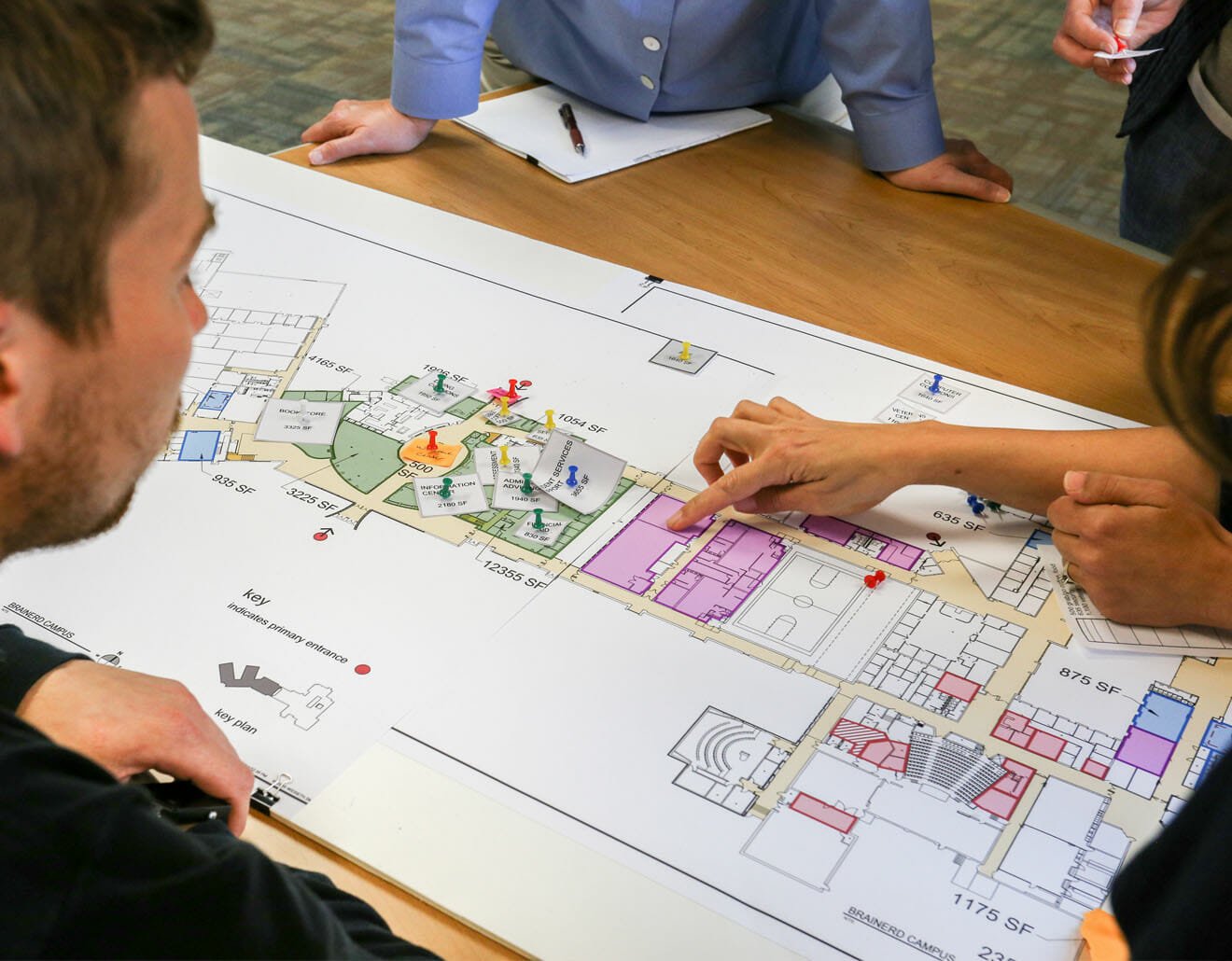 school, education, planning, meeting - K12 School Design A planning meeting for a K12 school project. Looking at architectural plans.