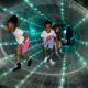Kids running through the International Tape Station at Great Lakes Science Center in Cleveland, OH